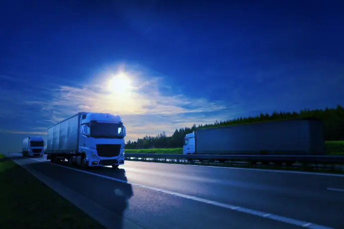 GPS-enabled tablets for trucks, vans, and freight logistics Freight trucks on highway using GPS and tracking devices